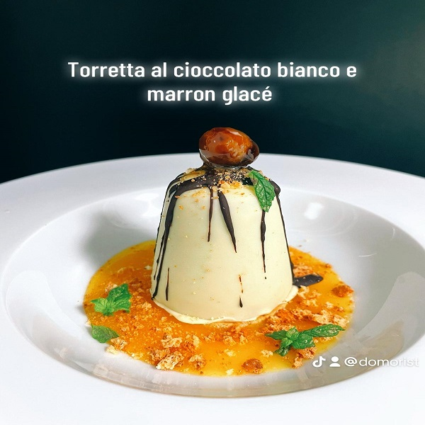 TORRETTA AL CIOCCOLATO BIANCO CON CIOCCOLATO FONDENTE E CASTAGNE SU ZUPPETTA DI MANDARINO
