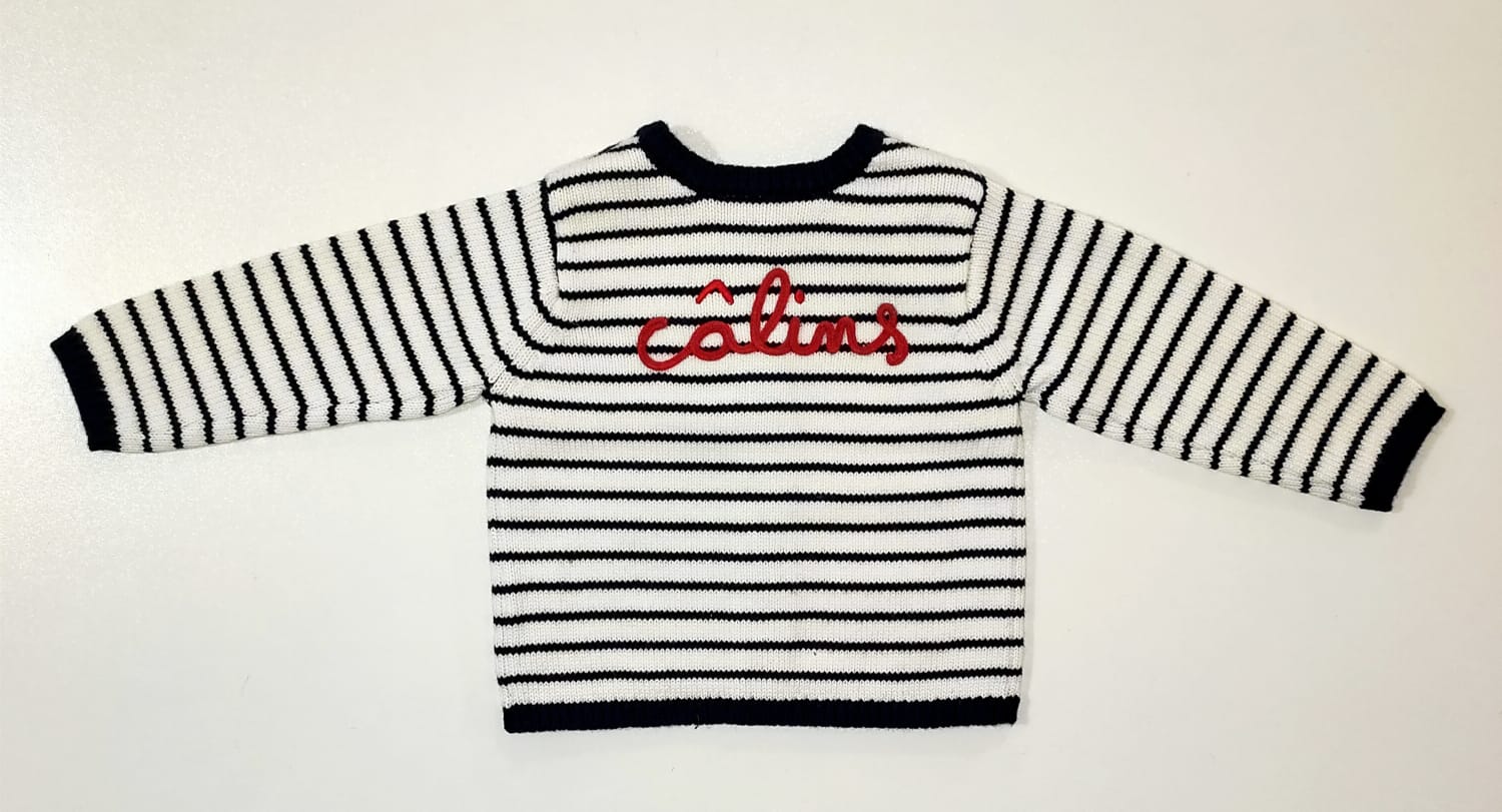 Cardigan blu e bianco a righe e chiusura anteriore con bottoni e scritta rossa sul retro ABSORBA