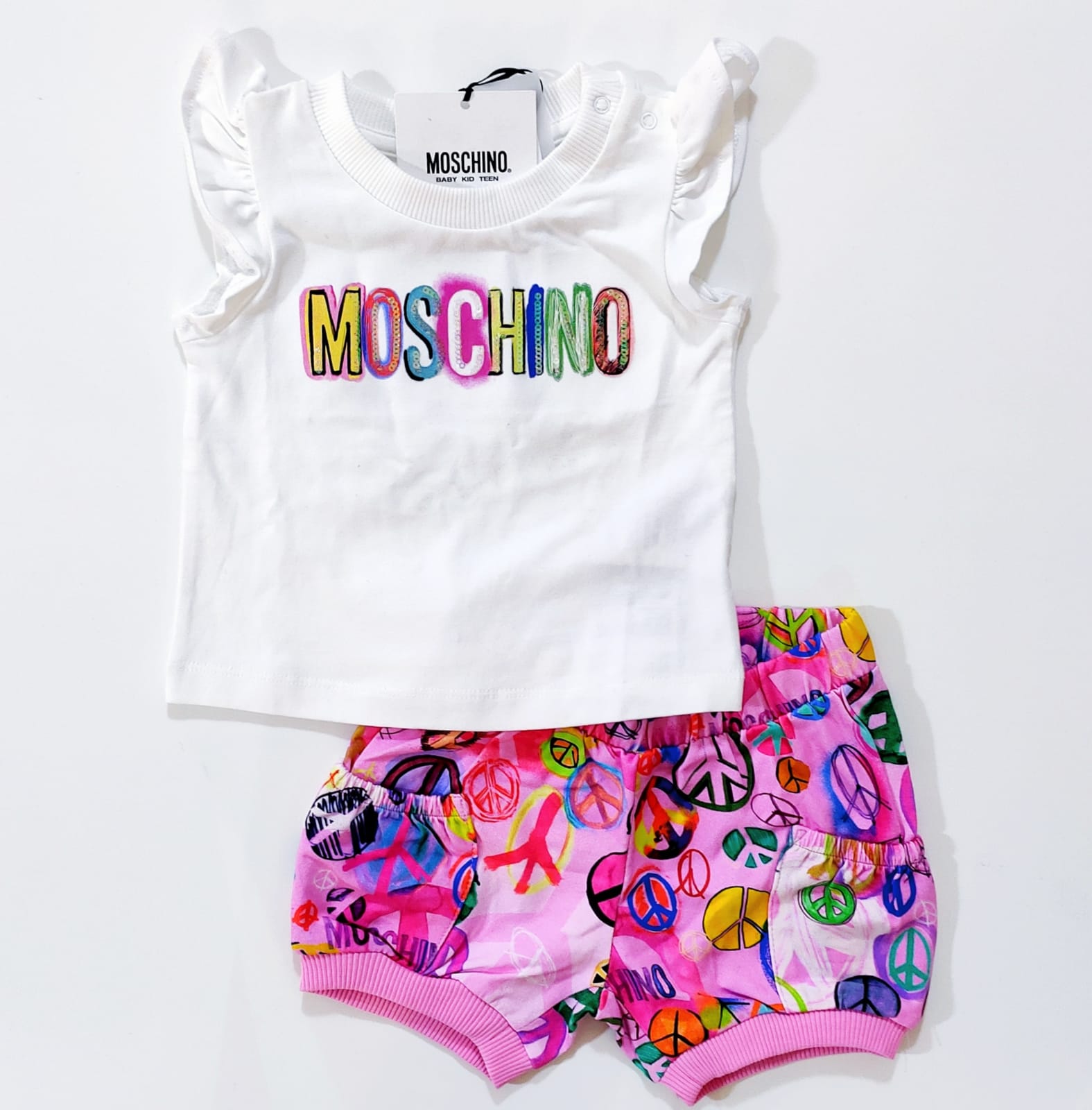 Compl.2pz t-shirt bianca logata e bermuda rosa simbolo peace&love MOSCHINO